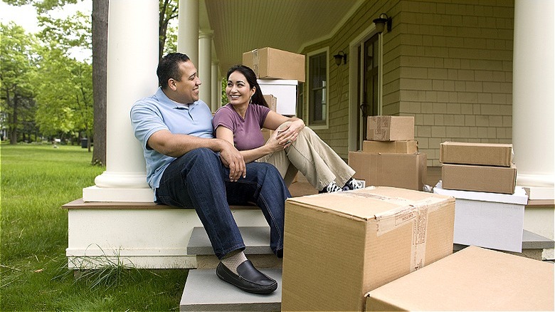 Couple resting during house move
