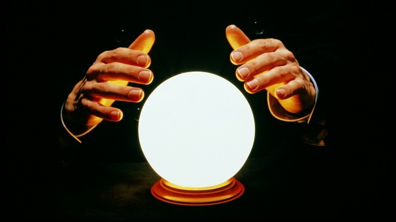 Hands and a crystal ball