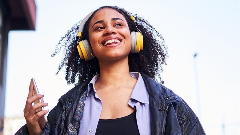 Person walking with headphones