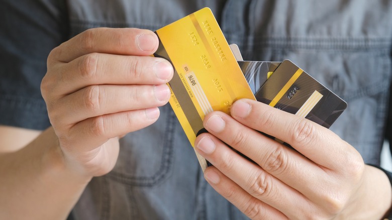Man holding credit cards