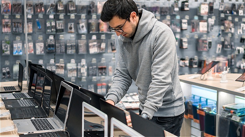 Person shopping for new laptop