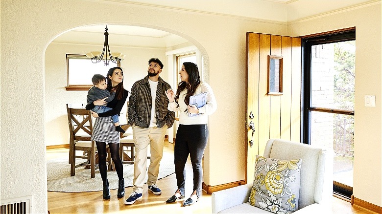 Agent discussing house with couple