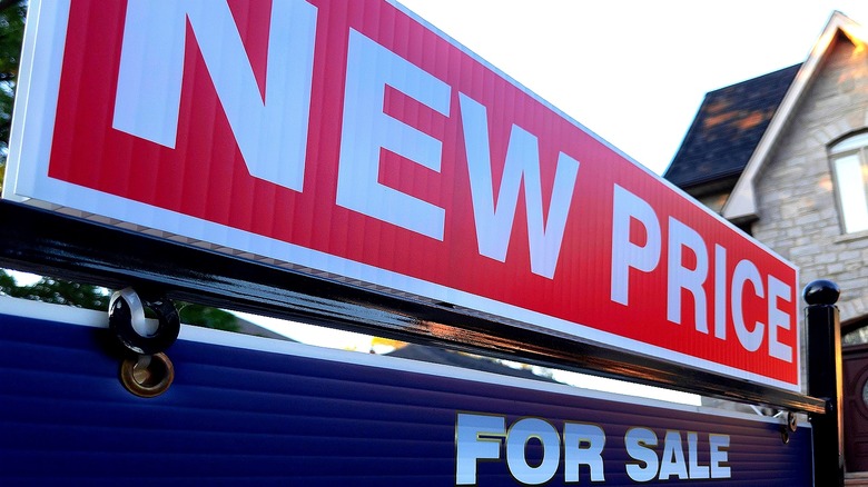 "NEW PRICE" home sale sign