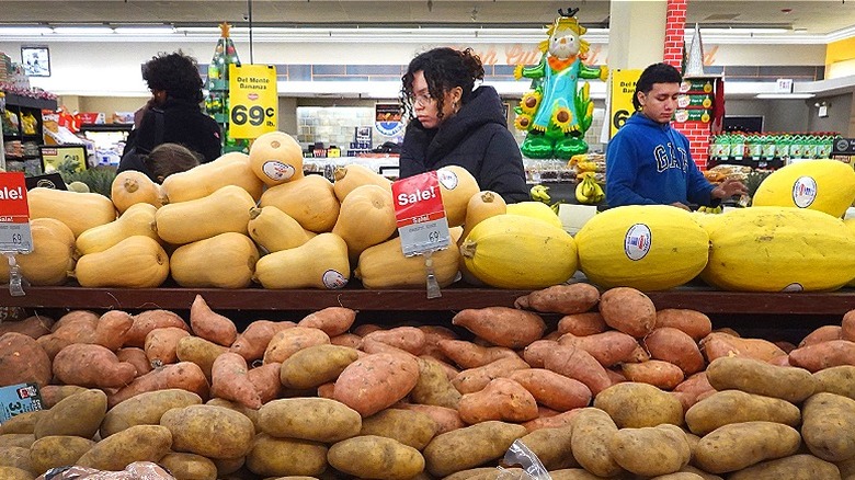 Consumers grocery shopping in store