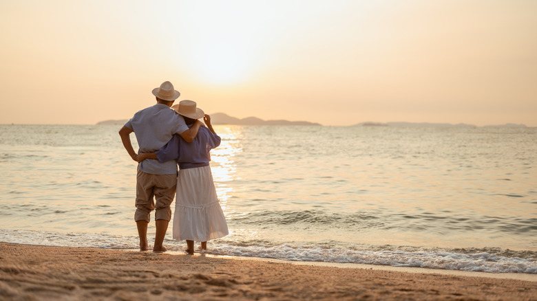 A couple standing together on a beach