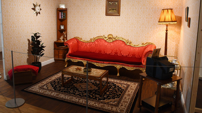 A wide shot of The Clive of India Sofa in St. Fagans Museum in Cardiff, Wales