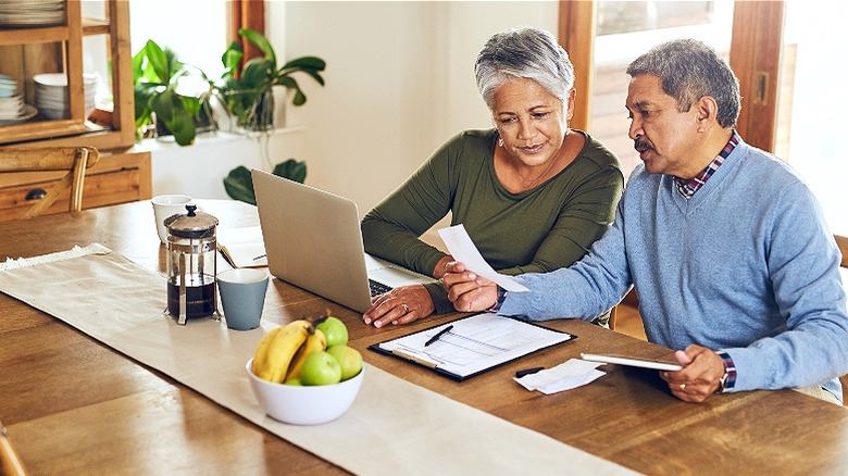 Older couple paying bills