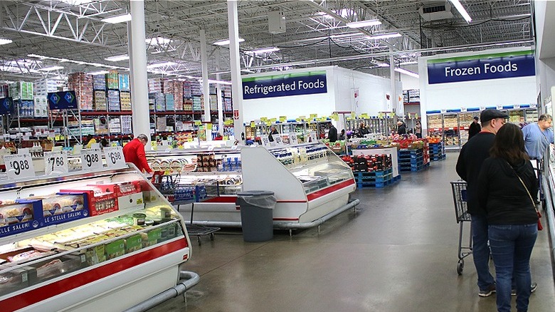 Shoppers browse the Sam's Club grocery section.