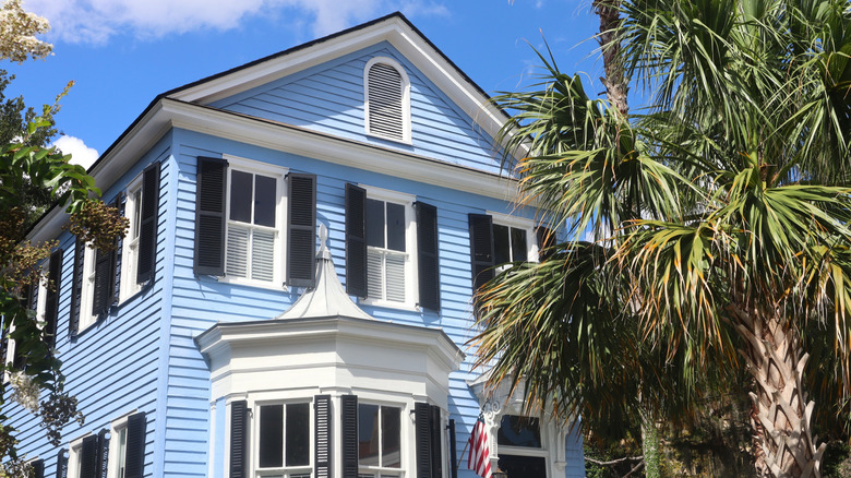 A two-story blue home in the Historic District of Beaufort/