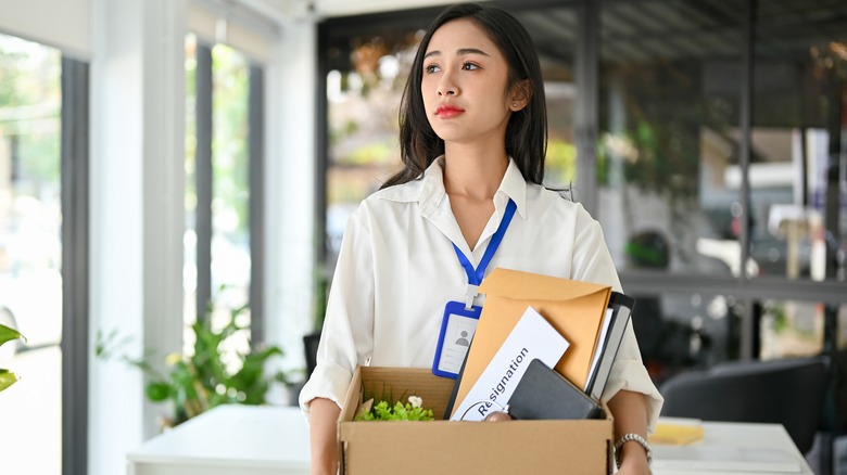 A woman holding a box