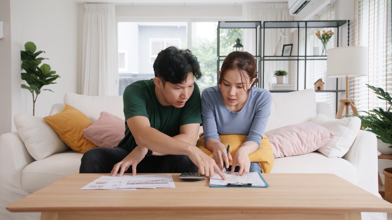 A young couple budgeting