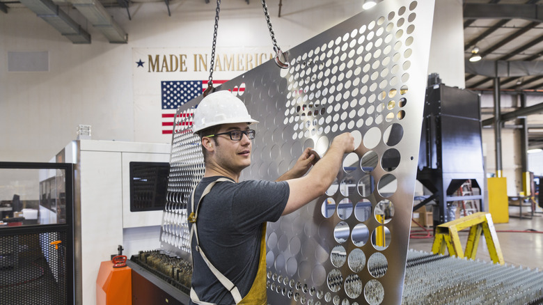 A laborer working in an industrial warehouse