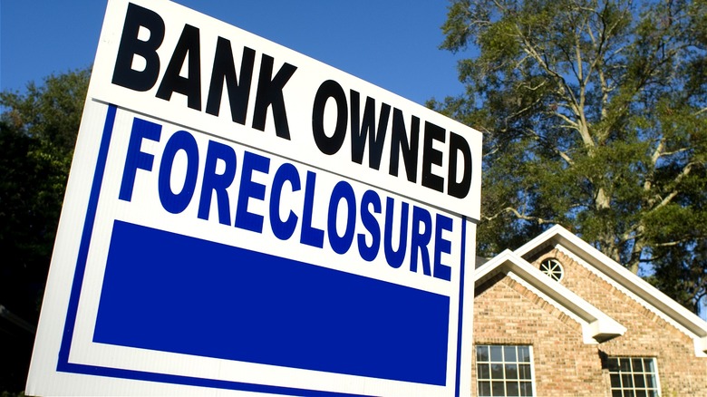 Foreclosure sign outside house