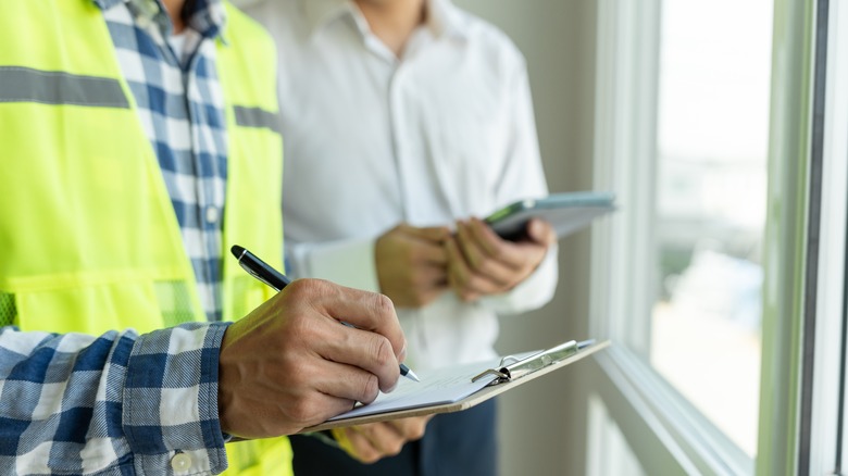 Two men inspecting a home