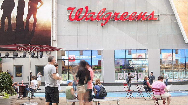 Shoppers outside of a Walgreens