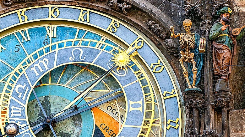 A very old astronomical clock in Prague, featuring skeleton and lute-player figural details