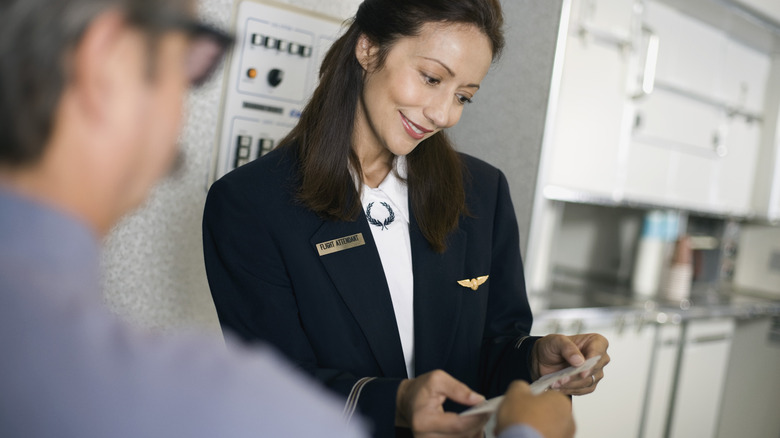 passenger presenting airline ticket