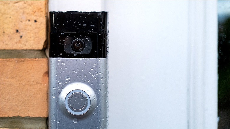 Close-up of doorbell with camera