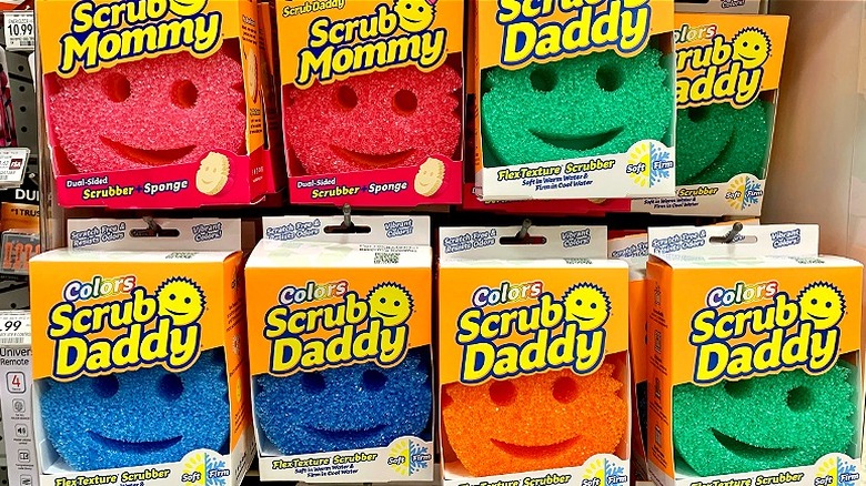 Different colored Scrub Mommy and Scrub Daddy sponges on store shelf