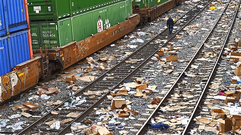Opened packages along train tracks
