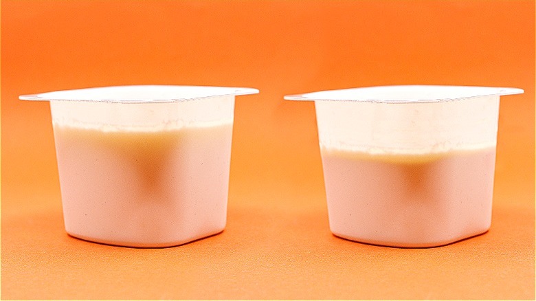 Two comparison yogurt cups