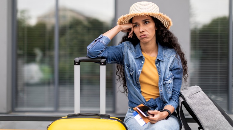 frustrated woman with suitcase