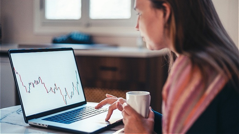 Person reviewing stocks at home