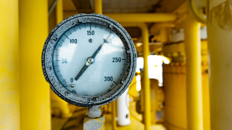 pressure gauge and yellow pipes