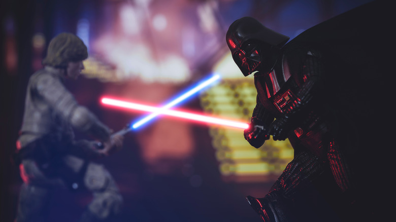 Stars Wars characters fighting with lightsabre weapons