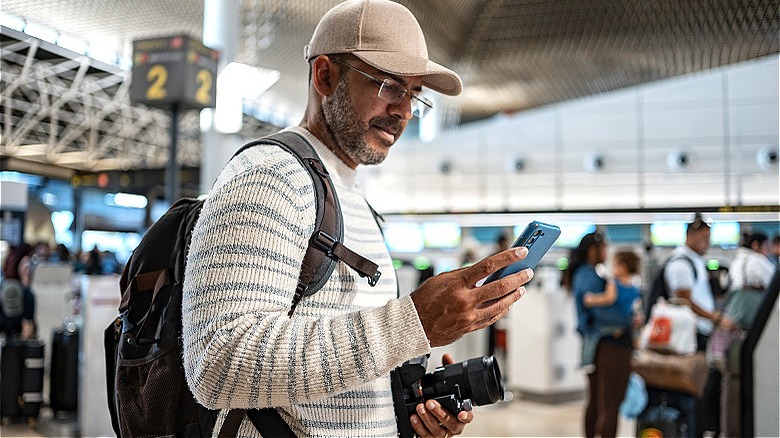 Person on phone at airport