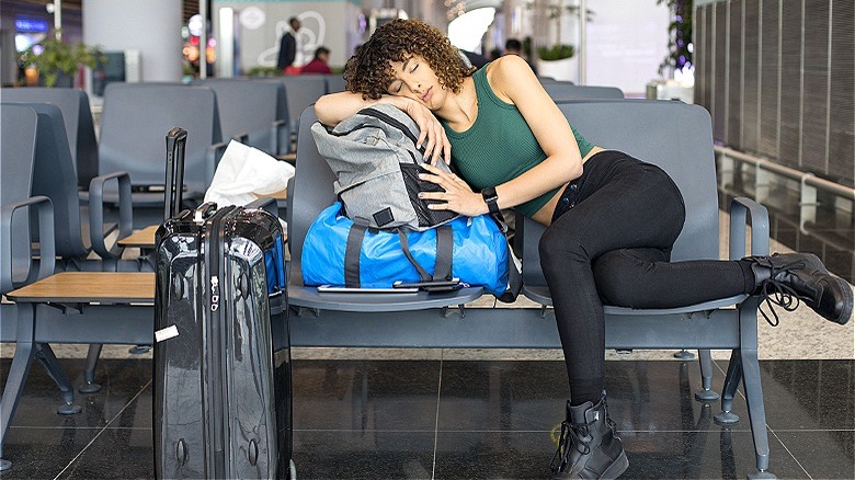 Person sleeping at airport
