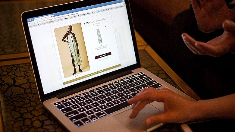 Person online shopping on laptop