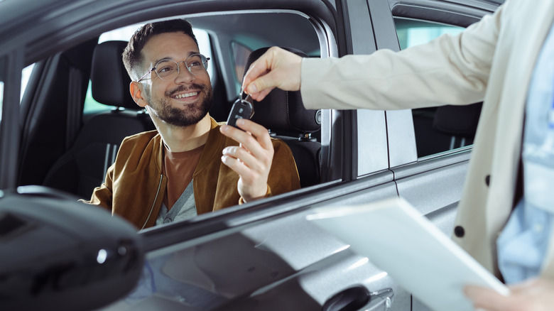 man receiving car keys