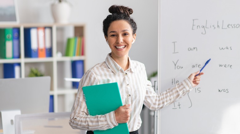 teacher in front of whiteboard