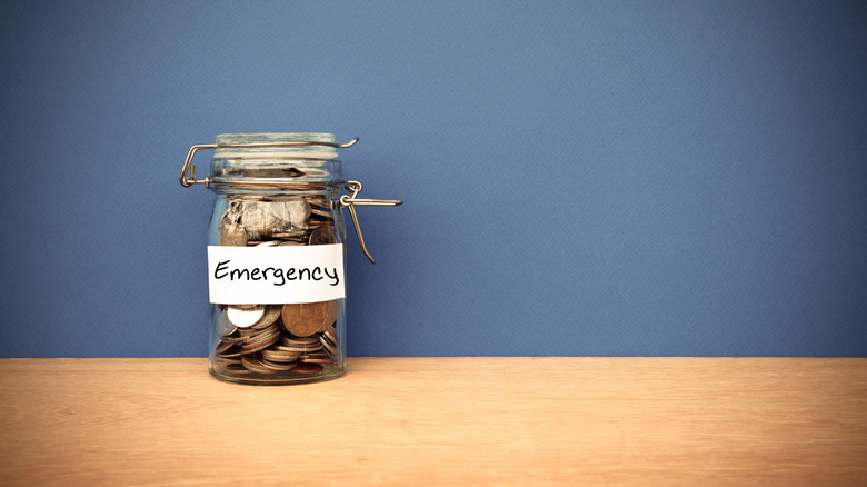 coins in an emergency fund jar