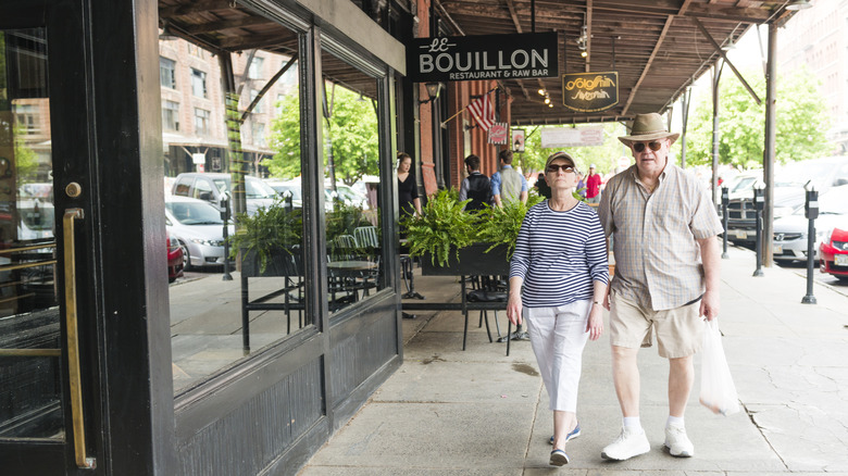 A retiree couple walking