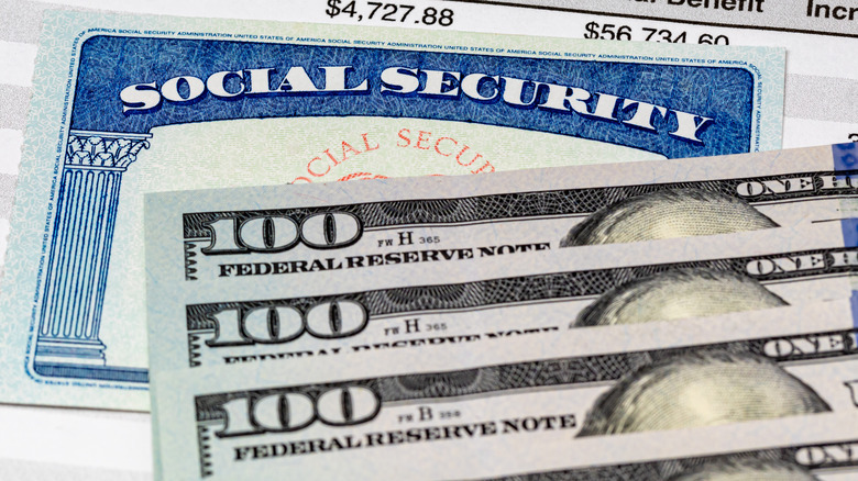 Cash is piled on Social Security card