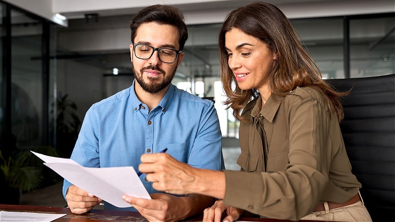 Two people reviewing financial plan