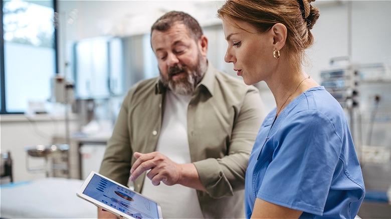 Nurse reviewing information with patient