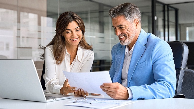 Adviser, client going over financials