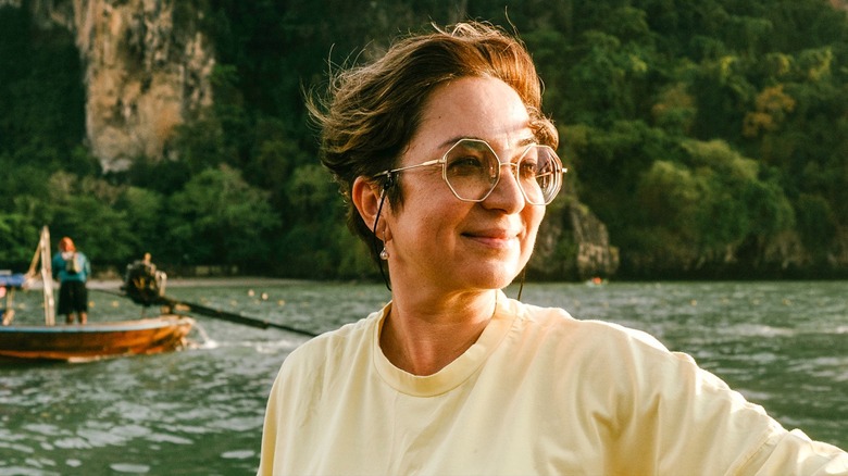 Smiling middle-aged woman on boat