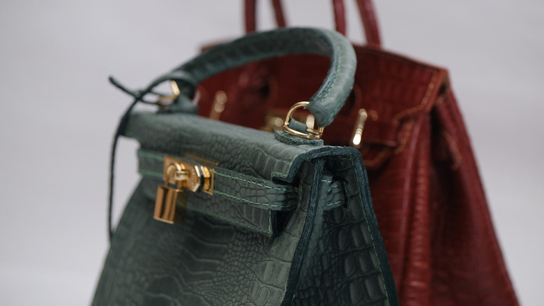 A closeup of two Birkin bags