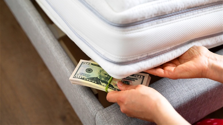 Hiding money under mattress