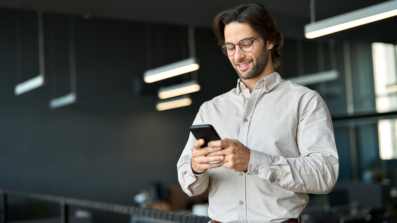 man looking at his cell phone