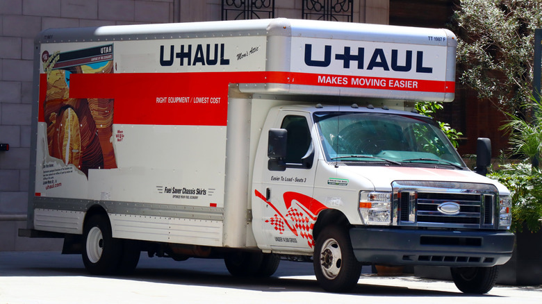 A U-Haul truck parked in a driveway