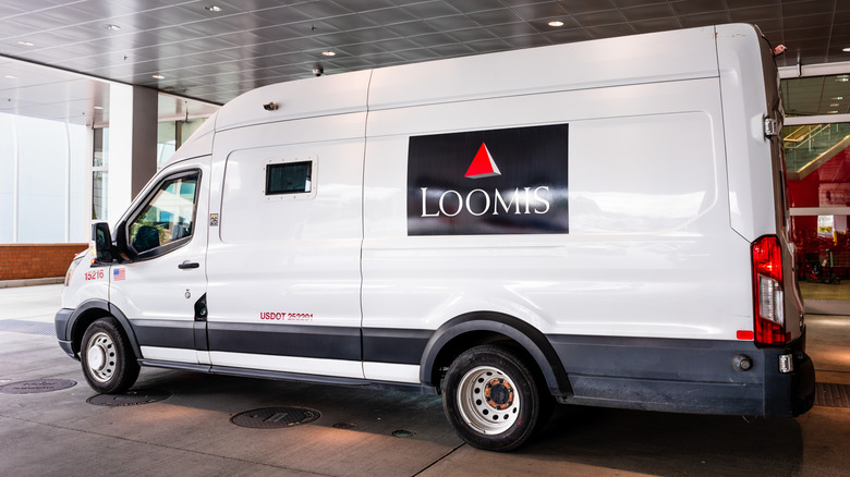 An armoured truck parked in a garage