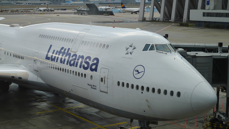 An airplane sitting on the tarmac at an airport