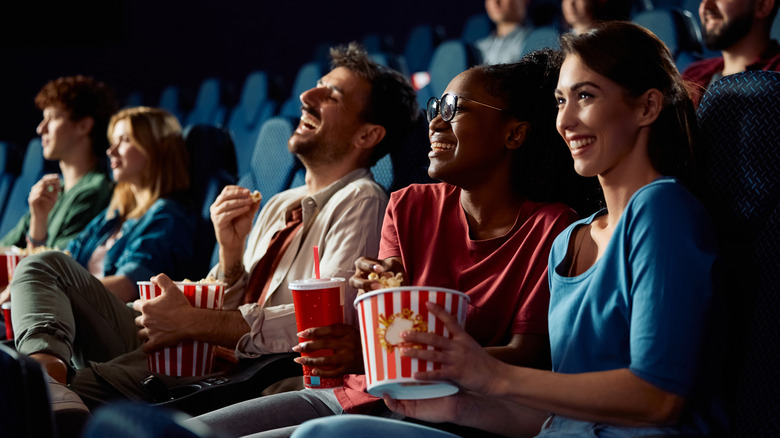 friends sitting in a movie theater