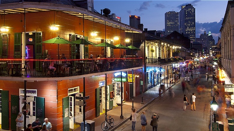 People walk down Bourbon Street