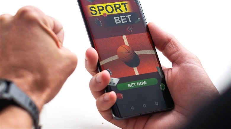 Person using mobile gambling app